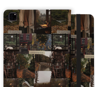 A protective iPad case featuring an autumn-themed collage print with bookshelves, cozy windows, a river scene, and text quotes. The case is shown in a three-quarter view to display both the front pattern and the black elastic closure band.
