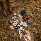 Country cases on a farm background with boots and hat